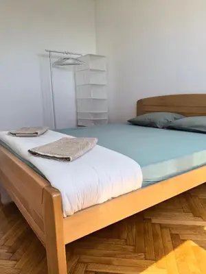 a bed in a room with a blue mattress at Jela in Belgrade