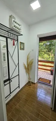 a room with a door open to a patio at Šumska Kosmaj in Nemenikuće