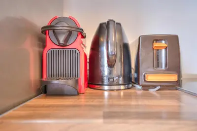 a group of different items sitting on a wooden table at Vračar Central Apartment in Belgrade