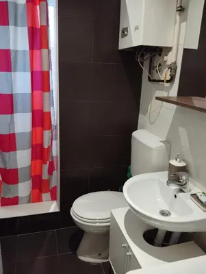 a bathroom with a toilet and a sink at Apartman Nera in Stara Pazova