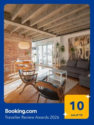 a living room with a couch and a table at URBAN GREEN Corner with a Story in Belgrade