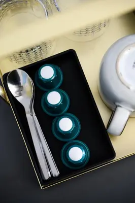 a black plate with green buttons on a table at URBAN DOWNTOWN luxury center Belgrade in Belgrade