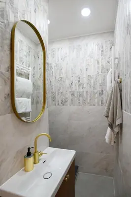 a bathroom with a sink and a mirror at URBAN DOWNTOWN luxury center Belgrade in Belgrade