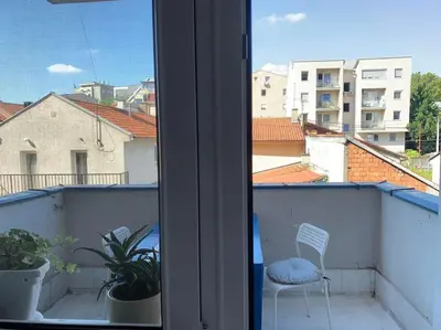a view from a window of a balcony with a chair at Belgrade Star with Free parking in Belgrade