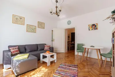 a living room with a couch and a table at Budislav lovely apartment in Belgrade