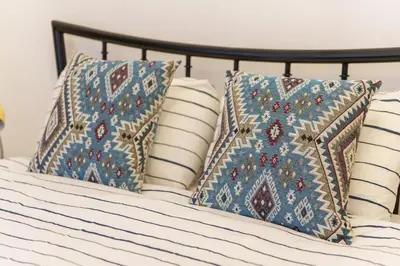 a bed with pillows on it with sidx sidx sidx at Budislav lovely apartment in Belgrade
