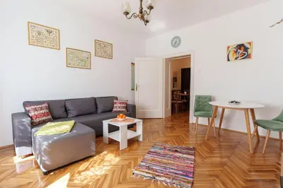 a living room with a couch and a table at Budislav lovely apartment in Belgrade