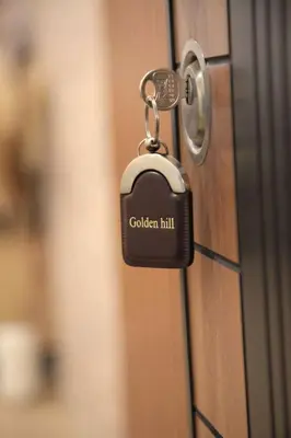 a lock on a door with the words golden hill at Golden hill Vinča in Vinča