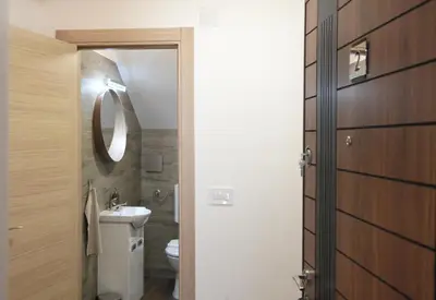 a bathroom with a toilet and a sink at Golden hill Vinča in Vinča