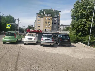 a group of cars parked in a parking lot at TikTok in Voždovac