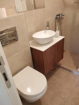 a bathroom with a white sink and a toilet at TikTok in Voždovac