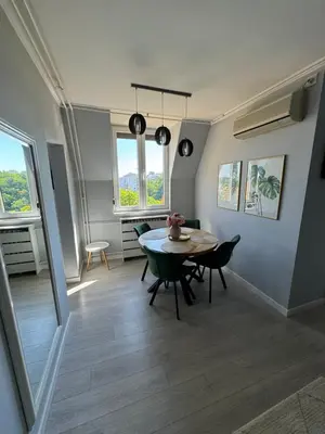 a dining room with a table and chairs at Ada View in Belgrade