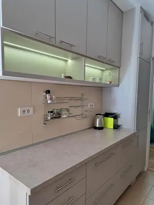 a kitchen with white cabinets and stainless steel appliances at Belgrade Stepa Stay in Belgrade