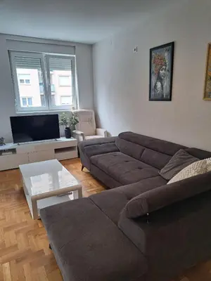 a living room with a couch and a tv at Belgrade Stepa Stay in Belgrade