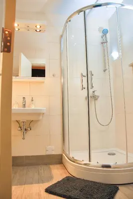 a bathroom with a shower and a sink at Hedonist Spa-ABlok 1 in Belgrade