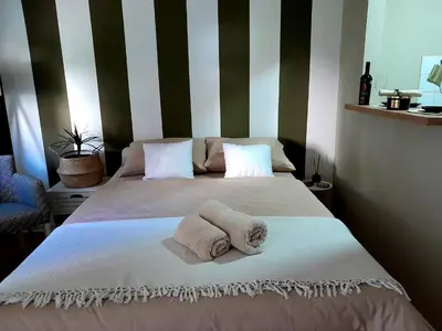 a bedroom with two beds with towels on them at HARMONY in Žarkovo