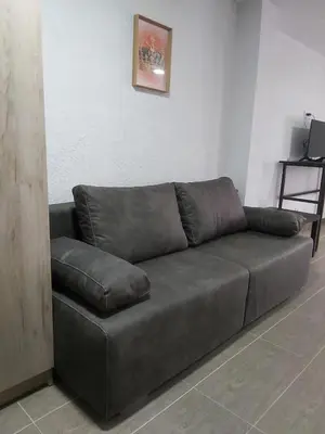 a brown leather couch in a living room at Vila Kruna in Belgrade