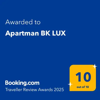 a yellow sign with the text awarded to an armeniankb luxiv at Apartman BK LUX in Belgrade