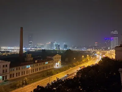 a view of a city at night with buildings and street lights at Sajam in Senjak (historical)