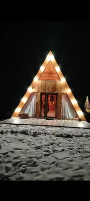 a tent with lights on it in the snow at Luna kuća- Devojački bunar in Novi Vladimirovac