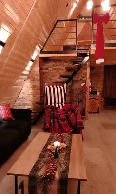 a living room with a couch and a coffee table at Luna kuća- Devojački bunar in Novi Vladimirovac