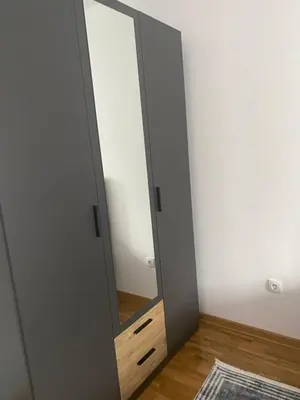 a mirror in the corner of a room at Apartman Fame near Airport in Surčin