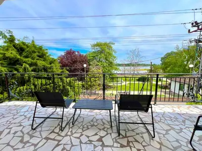 three chairs and a table on a patio at Plavi Dunav in Stari Slankamen