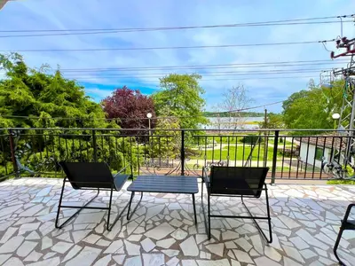 three chairs and a table on a patio at Plavi Dunav in Stari Slankamen