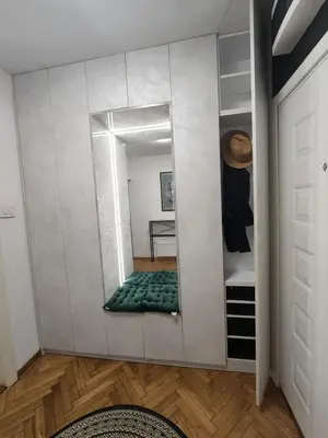 a mirror on a wall in a room at AirCity Apartment in Belgrade