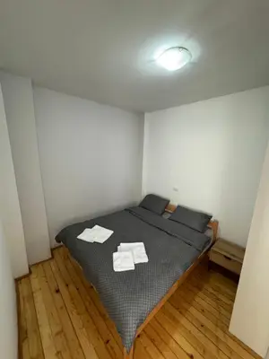 a bedroom with a bed with two towels on it at 89 rooms in Belgrade