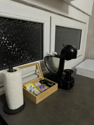 a bathroom counter with a sink and a mixer at 89 rooms in Belgrade
