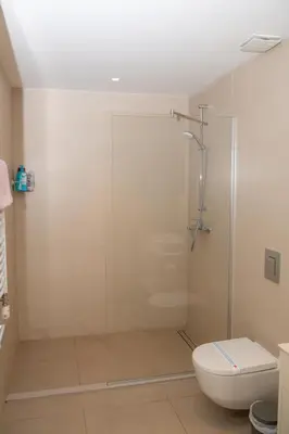 a bathroom with a shower and a toilet at Belgrade Waterfront Promenade in Belgrade