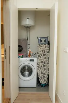 a laundry room with a washing machine and a washer at Belgrade Waterfront Promenade in Belgrade