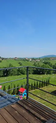 a view of a playground from a deck at Vila Duplex in Lipovica