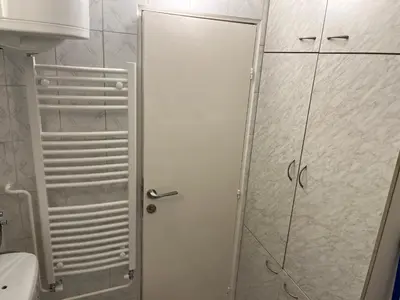 a shower with a glass door in a bathroom at Comfort & Style Panoramic Urban Retreat in Novi Beograd