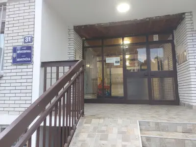 an entrance to a building with a revolving door at Stay4day in Kijevo