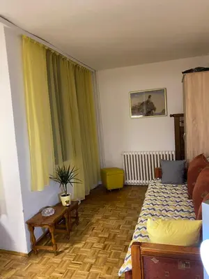 a living room with a bed and a table at Stay4day in Kijevo
