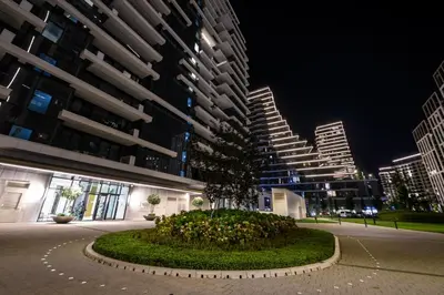 a building with a tree in the middle of a street at Luxury apartment with Pool&Gym in Belgrade
