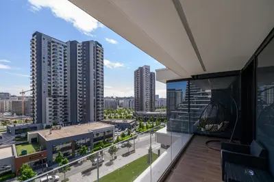 an apartment balcony with a view of a city at Luxury apartment with Pool&Gym in Belgrade