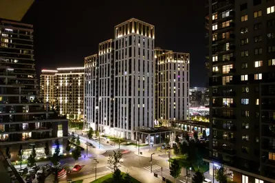 a view of a city at night with tall buildings at Luxury apartment with Pool&Gym in Belgrade
