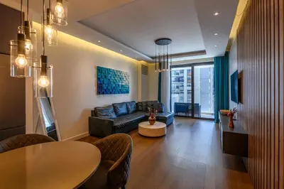 a living room with a couch and a table at Luxury apartment with Pool&Gym in Belgrade