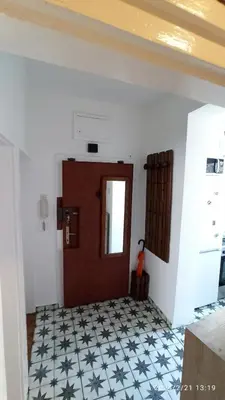 a room with a door and a tile floor at Stan na dan Beograd in Karaburma