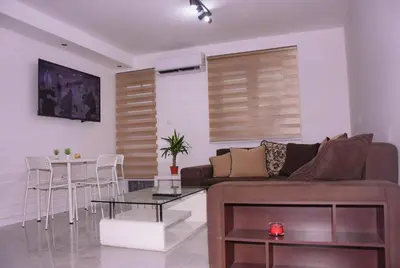 a living room with a couch and a table at Marash apartman - stan na dan in Belgrade