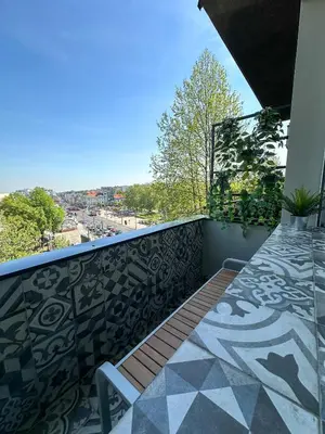 a balcony with a bench and a tile floor at Apartment 5A - Experience true Belgrade! in Belgrade
