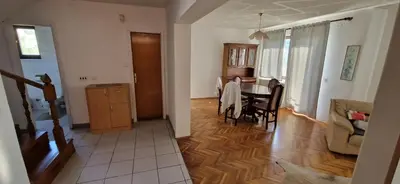 a living room with a table and a dining room at Beautiful large villa Vrčin in Vrčin