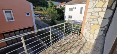 a balcony with a railing next to a building at Beautiful large villa Vrčin in Vrčin