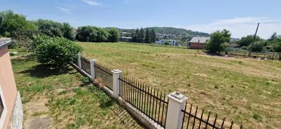 a fence in the middle of a field at Beautiful large villa Vrčin in Vrčin