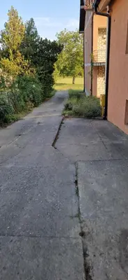 an empty street in front of a building at Beautiful large villa Vrčin in Vrčin