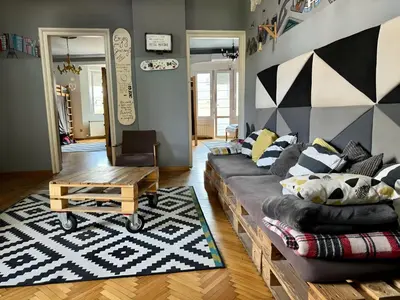 a living room with a couch and a table at Nomad Hostel in Belgrade