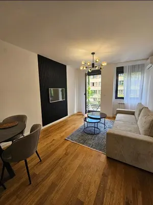 a living room with a couch and a table at Luxury new apartment in Belgrade in Belgrade